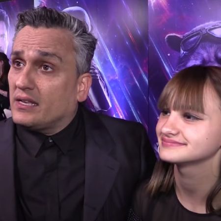 Ava and Joe Russo are both dressed in all black clothes.